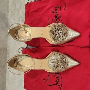 Gold Louboutin heels